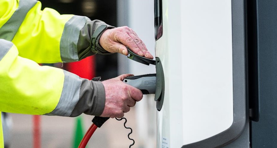 A Northgate technician preparing to use one of our onsite chargers to refuel a vehicle.